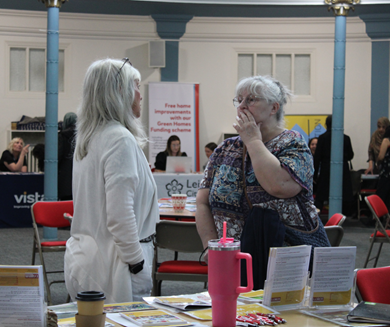 Two ladies talking at stall