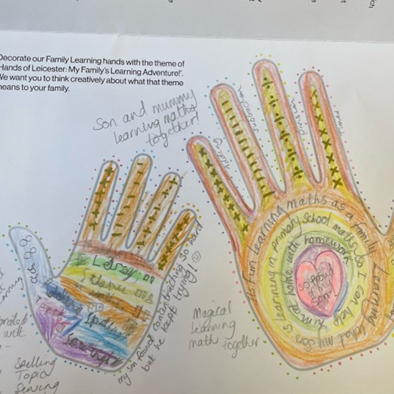 Entry from winner 2. Hands show lots of colours, with numeracy matters and words to connote maths learning.