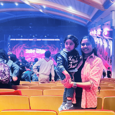 Mother and son in front of stage at Demontfort Hall.