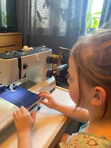 Rebeca's Daughter using sewing machine