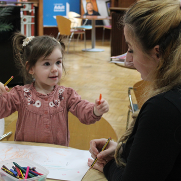 mother doing crafts with child